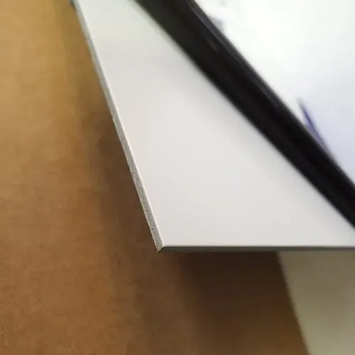 Close-up of a 3mm MaxMetal aluminum composite panel edge showing the thin flat profile