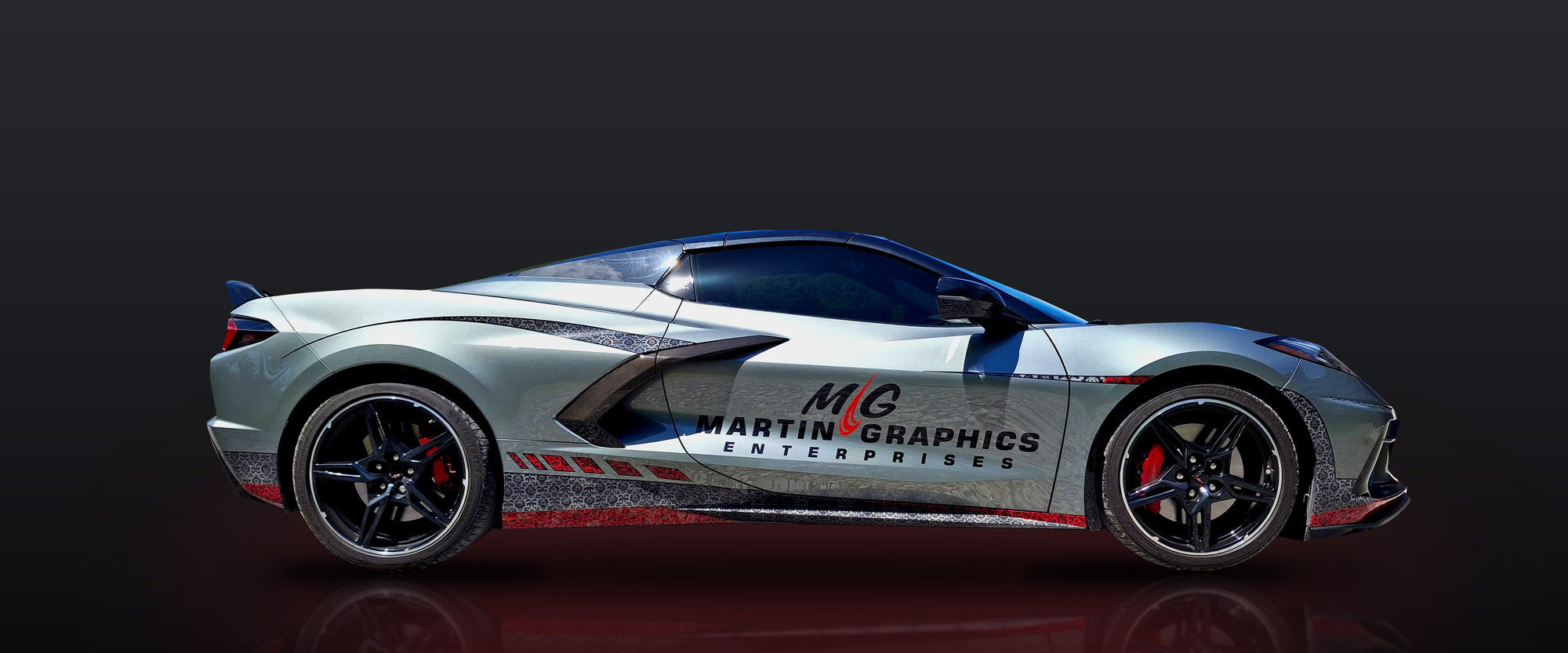 Martin Graphics' own C8 Corvette wearing the shop's custom wrap and business branding