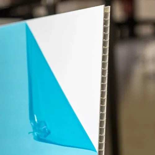 Close-up of a 10mm AlumaCorr panel edge showing the corrugated aluminum core and protective film