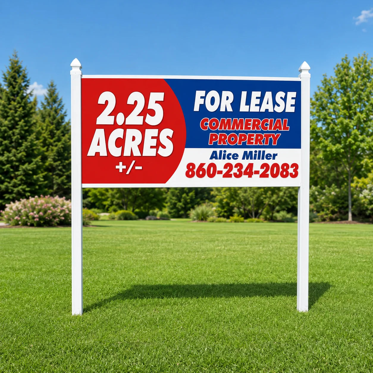 Post and rail sign kit installed on a lawn — two white square posts with caps and a top rail holding a full-color commercial real estate sign panel