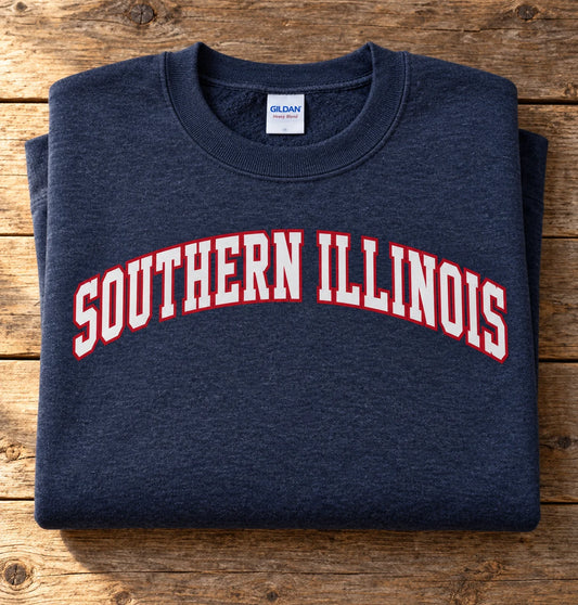 Custom Gildan Heavy Blend crewneck sweatshirt in Heather Navy with arched SOUTHERN ILLINOIS DTF print, folded on a wood table