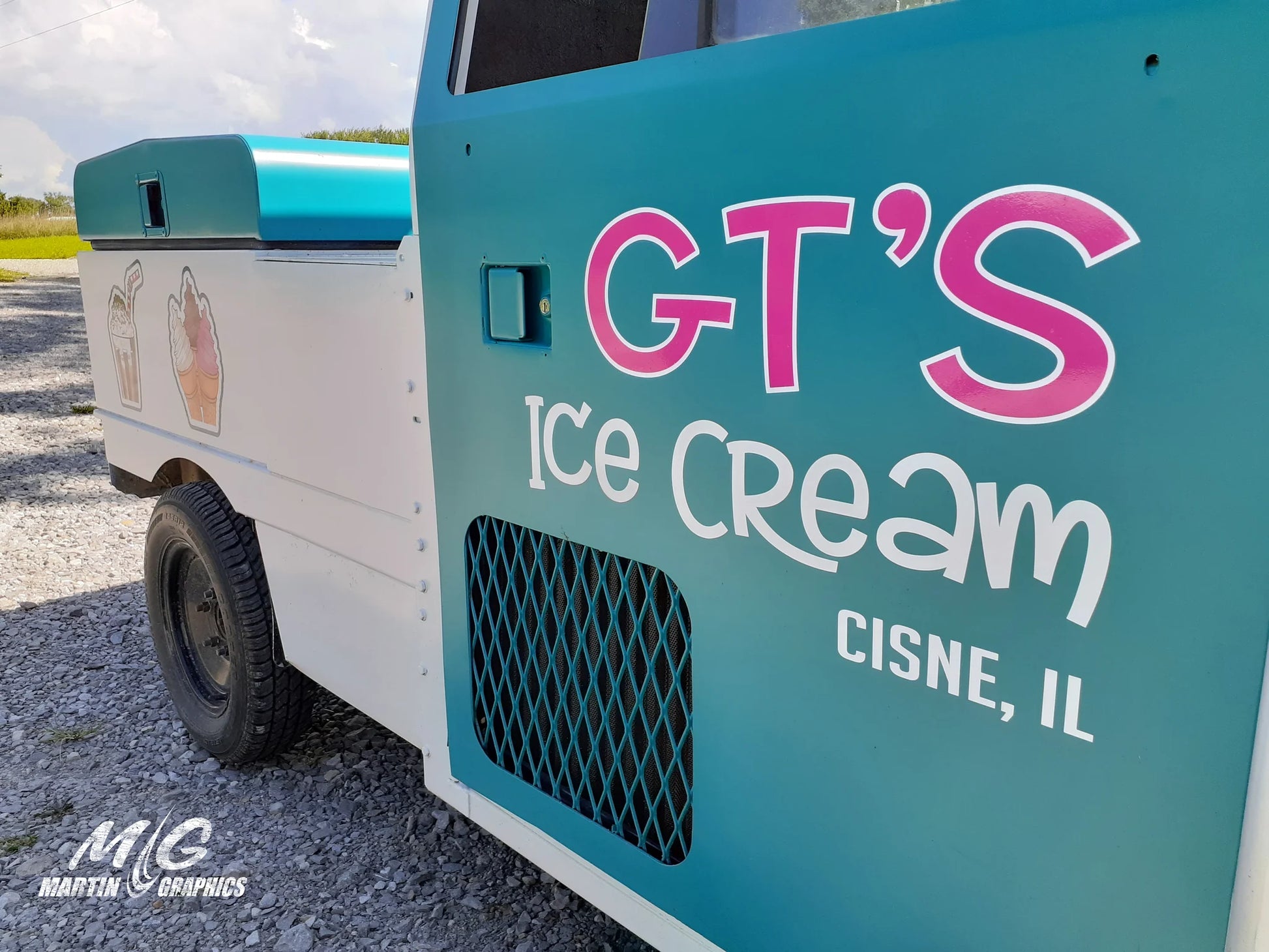 Custom cut vinyl lettering and contour-cut logo decals on an ice cream truck, applied to the paint with no background