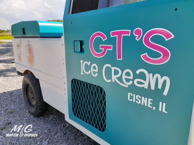 Truck door with cut vinyl company lettering and contour-cut logo decals applied together as one layout, no background