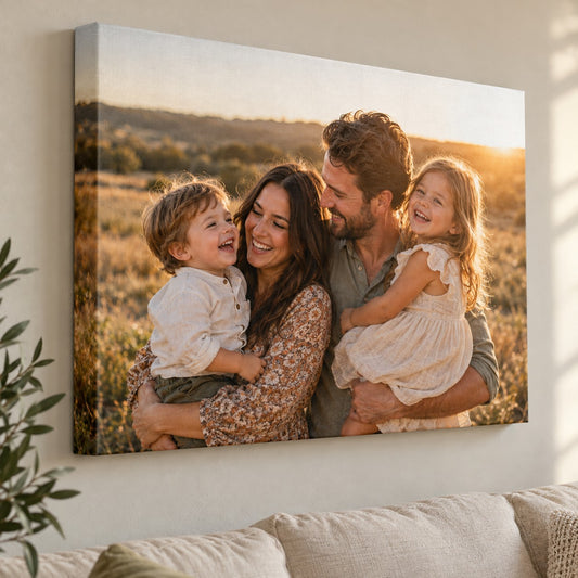Custom photo canvas print of a family photo, gallery wrapped, hanging above a sofa