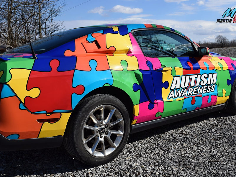 Autism awareness puzzle-piece Mustang wrap by Martin Graphics