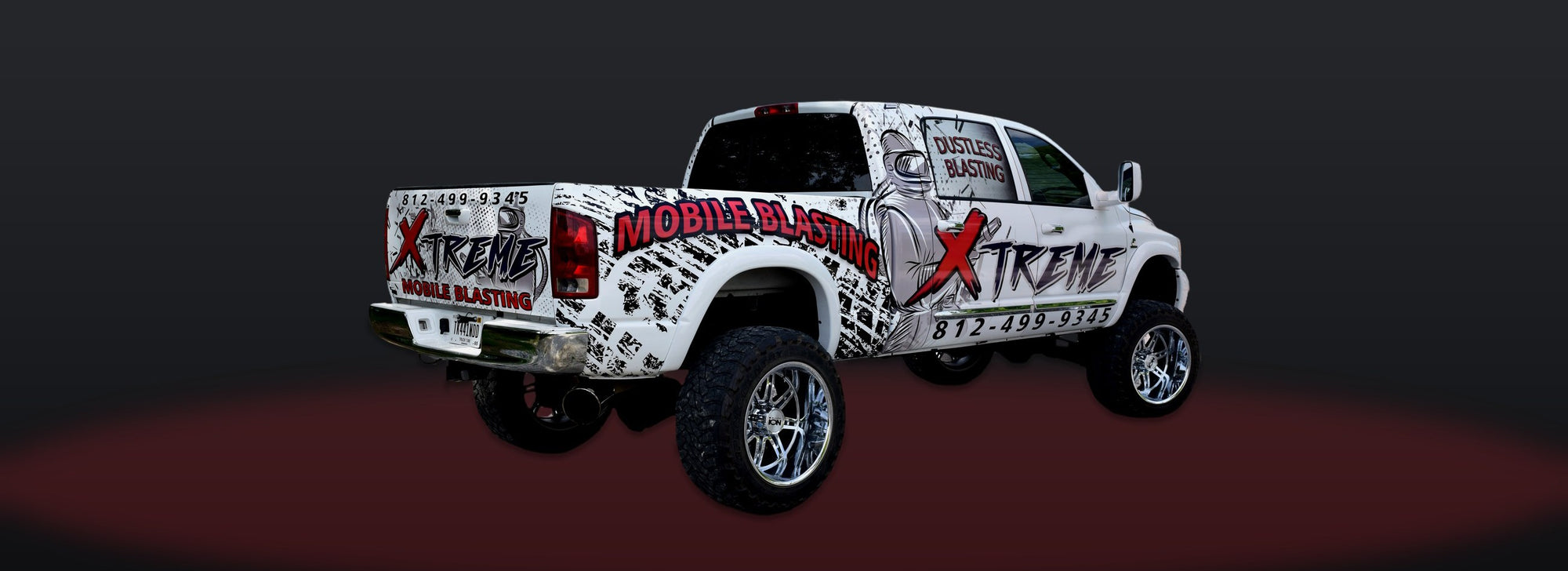 Xtreme Mobile Blasting lifted Ram truck wrap by Martin Graphics
