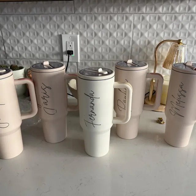 Personalized 40 oz tumblers with engraved names — customer supplied photo
