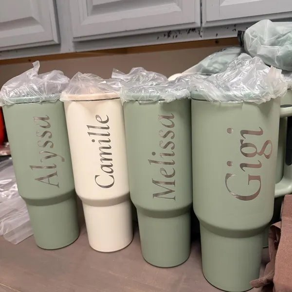 Sage green tumblers engraved with names — customer supplied photo