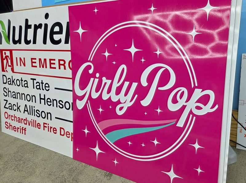 Fire department banner and Girly Pop sign