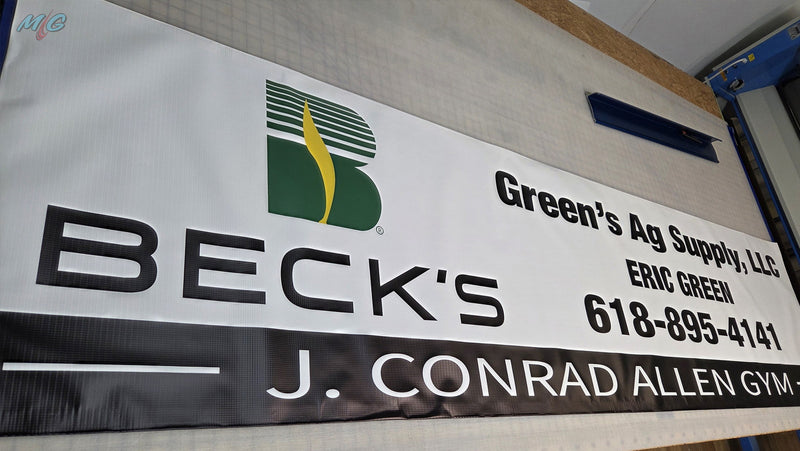 Printed vinyl banner for Green's Ag Supply featuring the Beck's Hybrids logo, sponsoring the J. Conrad Allen Gym
