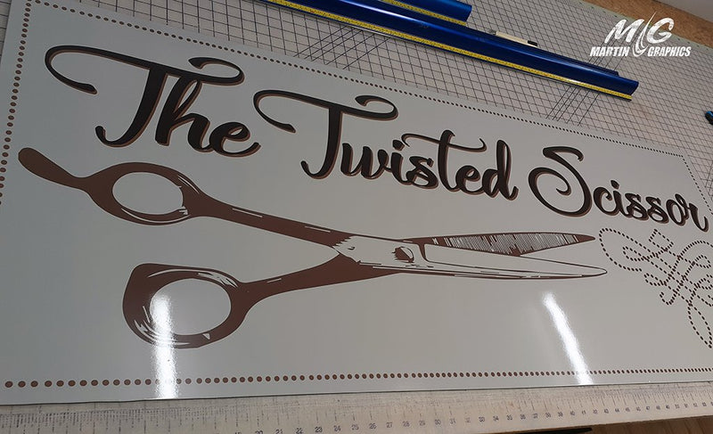 Twisted scissor — custom signage