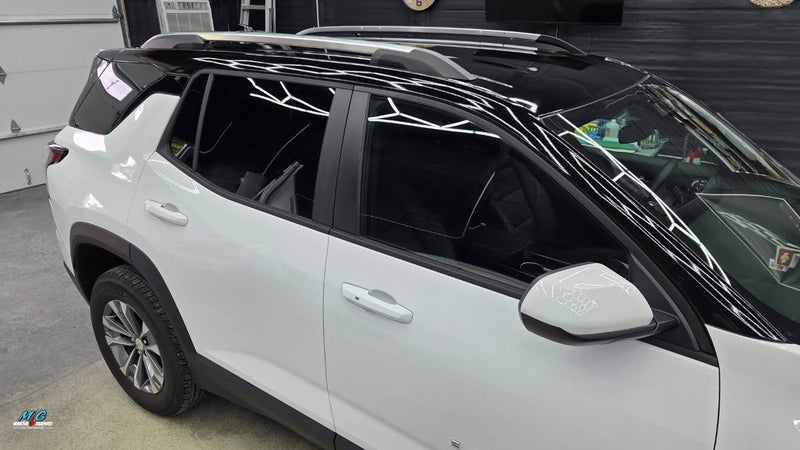 Gloss black roof wrap on an SUV