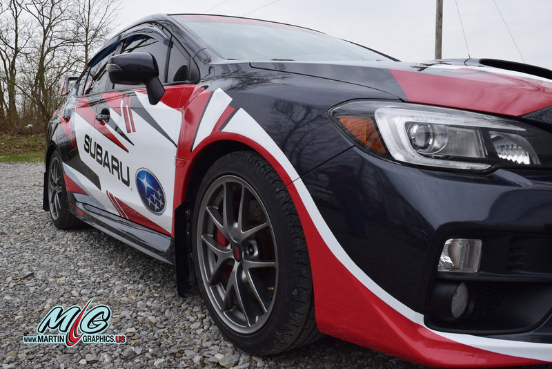 Rally style racing livery wrap on a Subaru